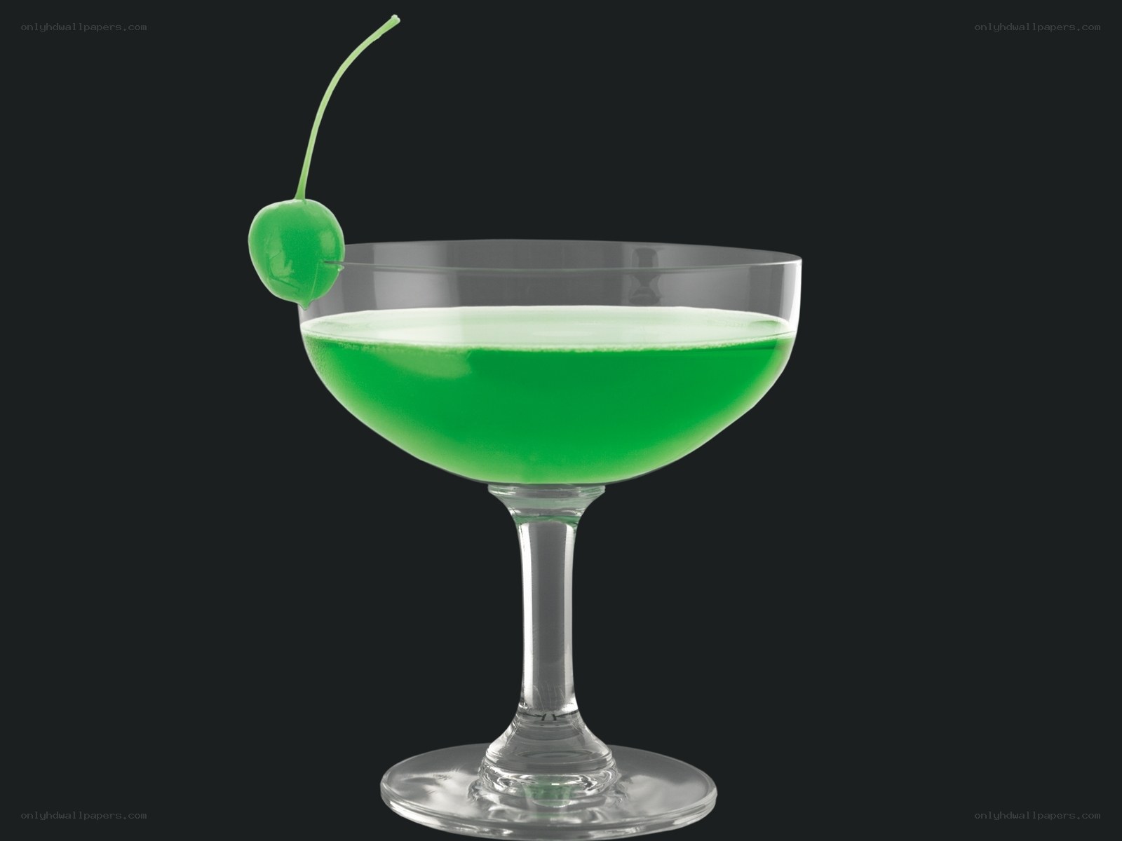 green cocktail with cherry
