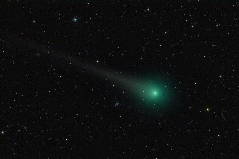 Green comet in starry sky