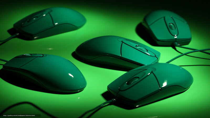 Green computer mice on surface