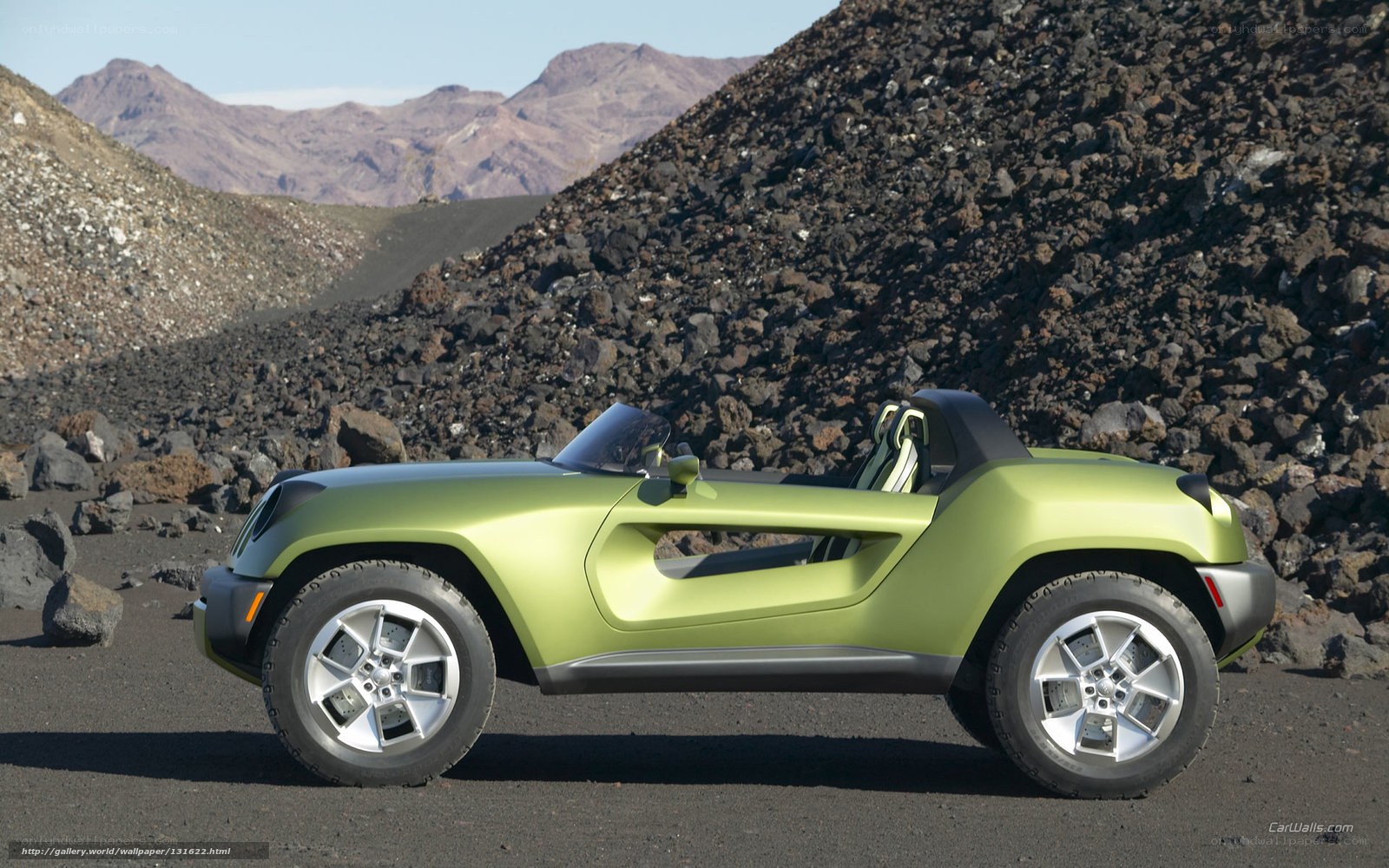 Green concept car in desert