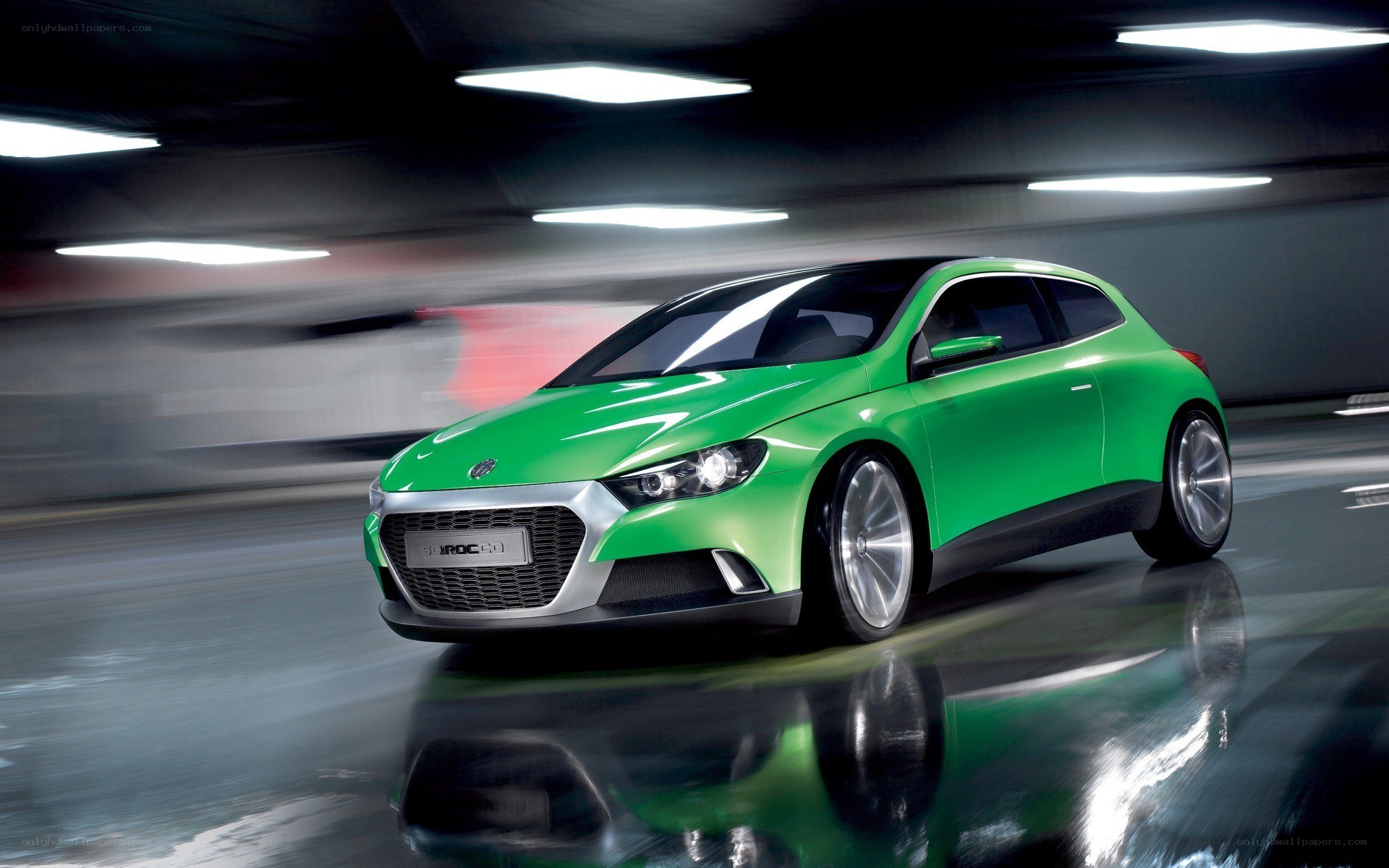 Green concept car in motion
