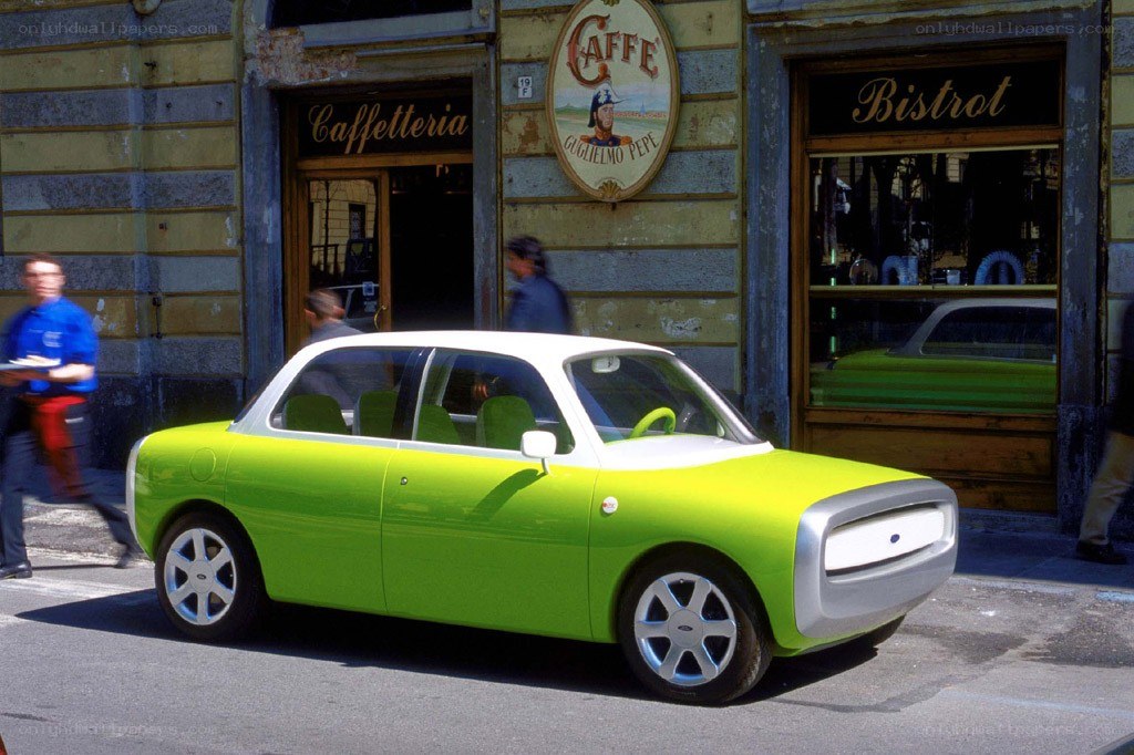 Green concept car on street
