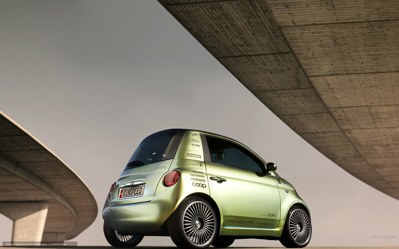 green concept car under bridge