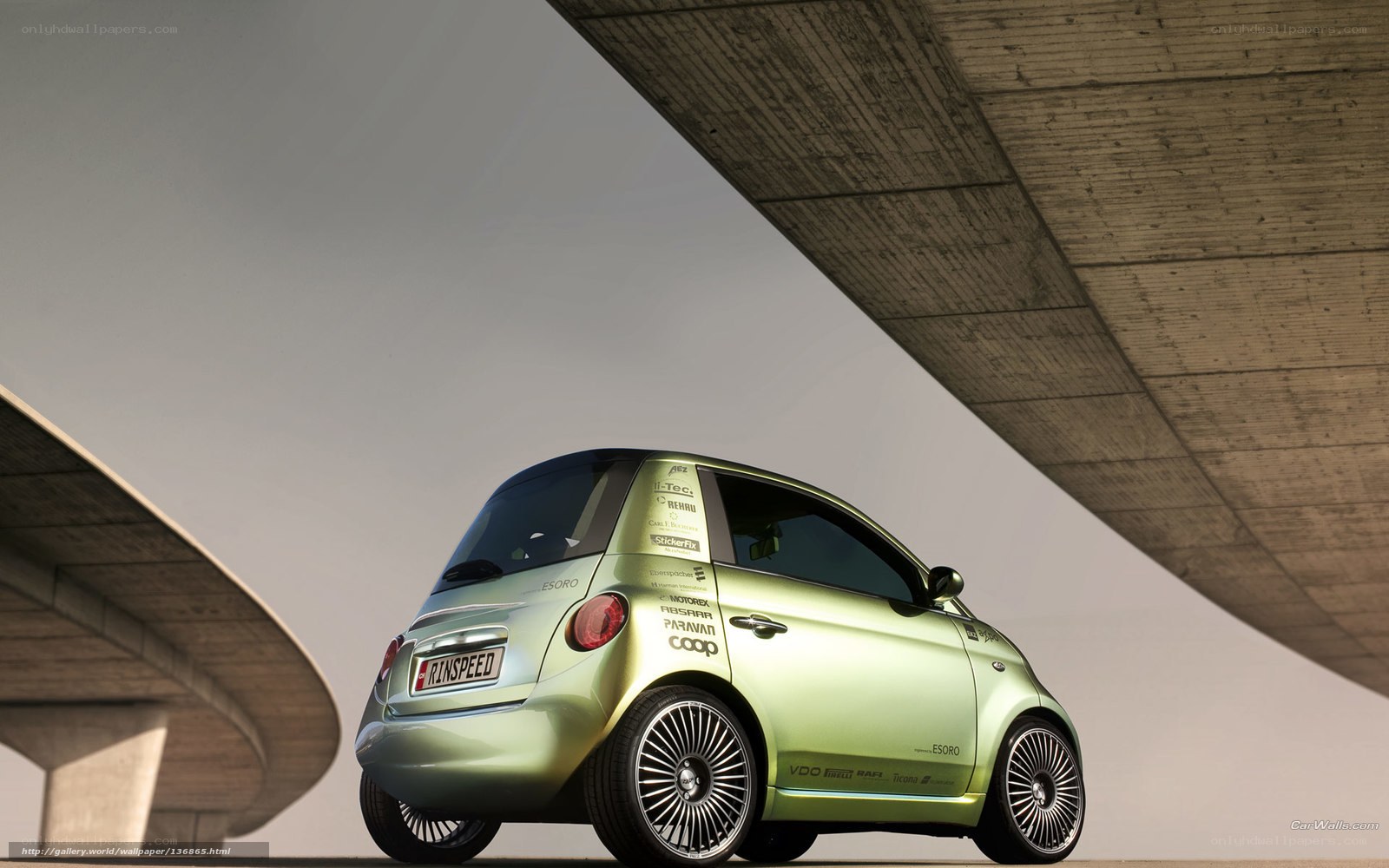 green concept car under bridge