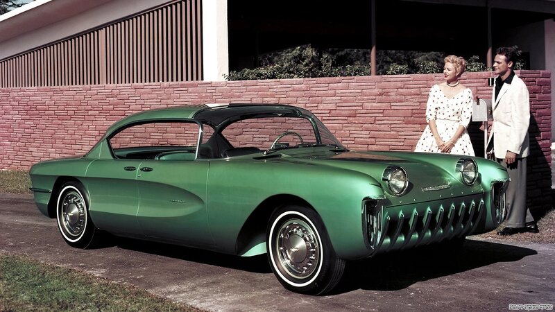 Green concept car with couple