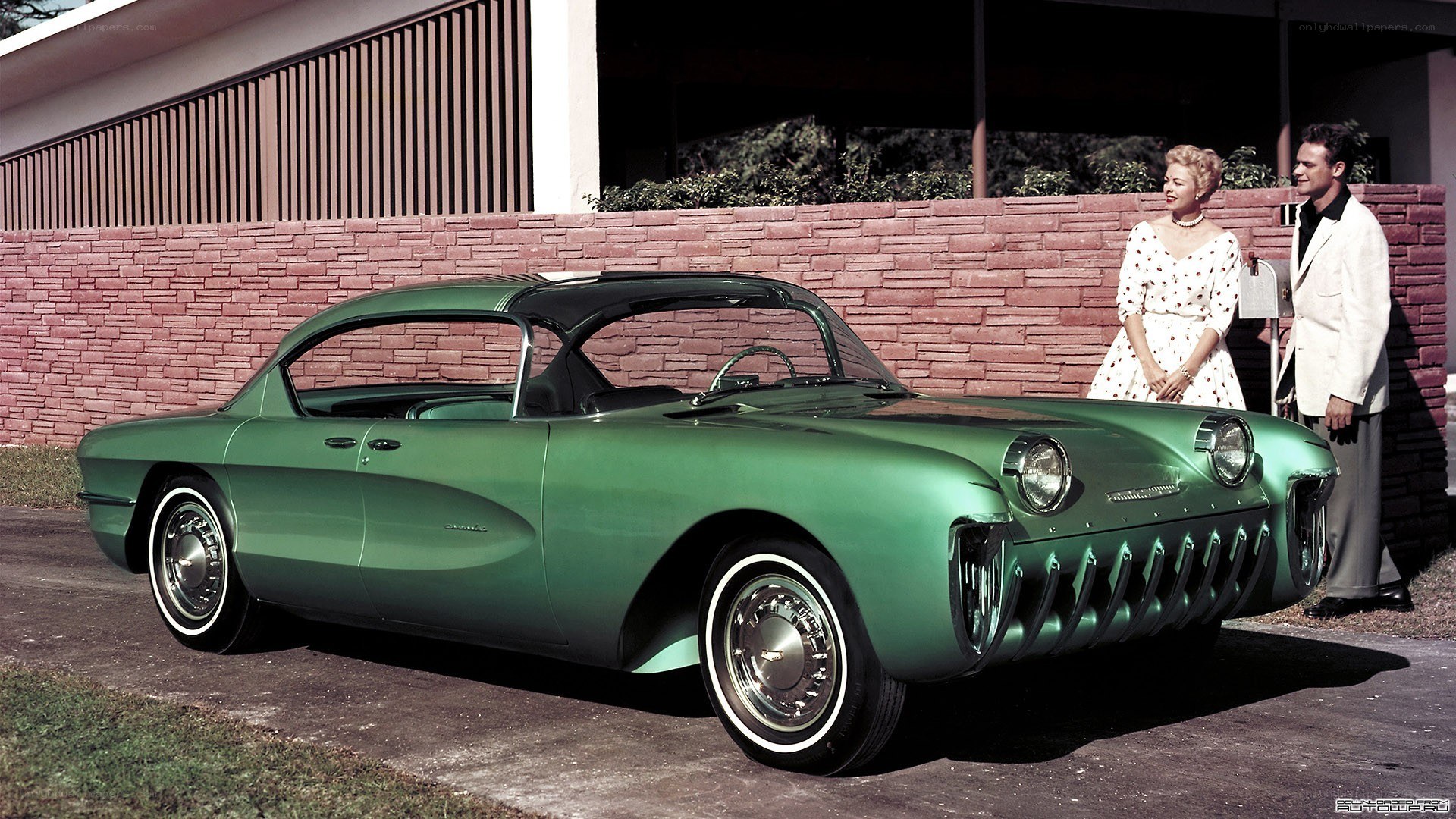 Green concept car with couple