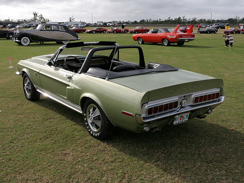 Green convertible at car show