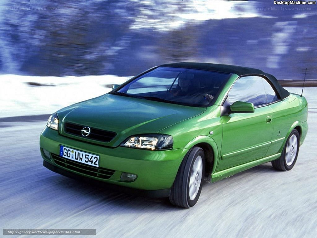 green convertible car in motion