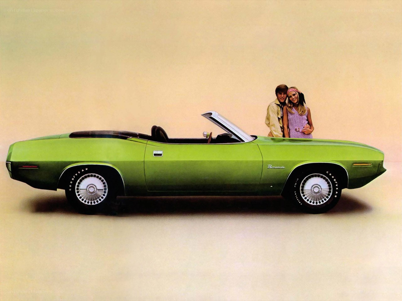Green convertible with couple