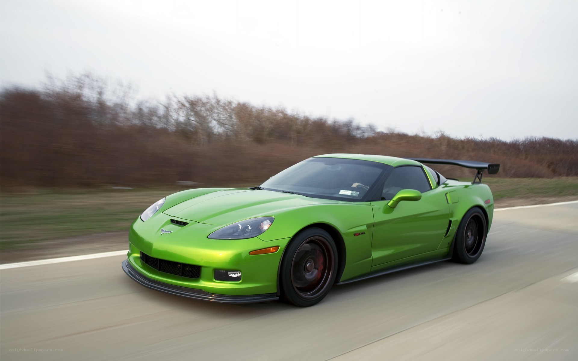 green corvette driving on road