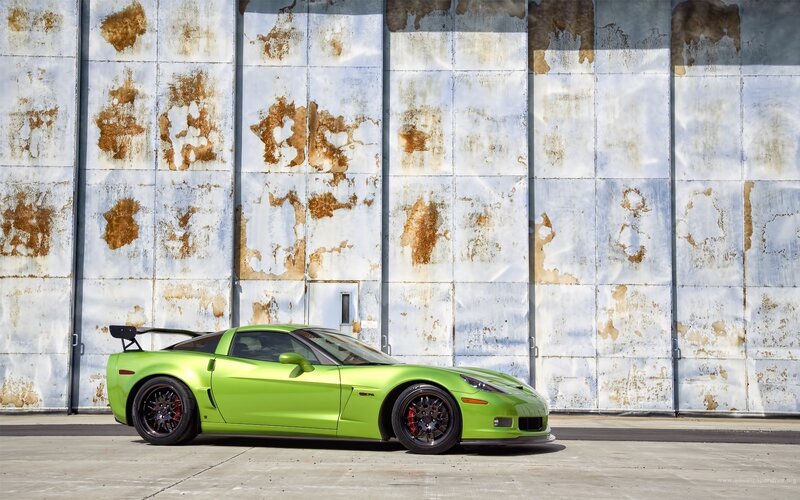 Green Corvette on a Rusty Wall