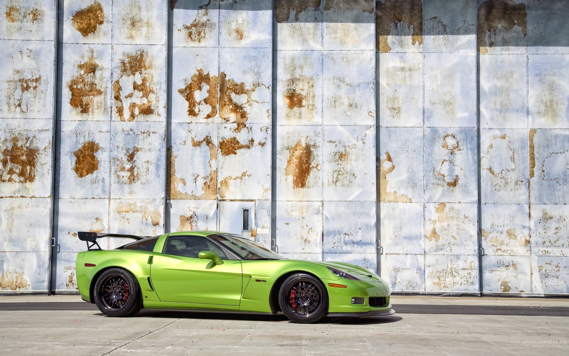 Green Corvette on a Rusty Wall