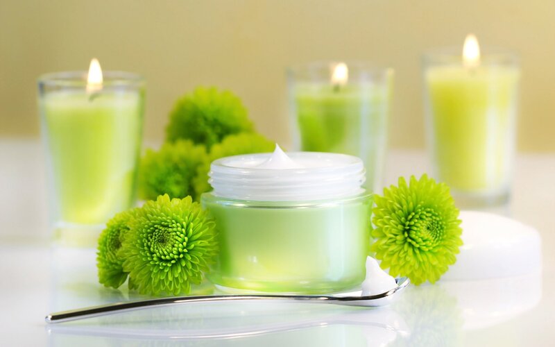 Green cream with candles and flowers
