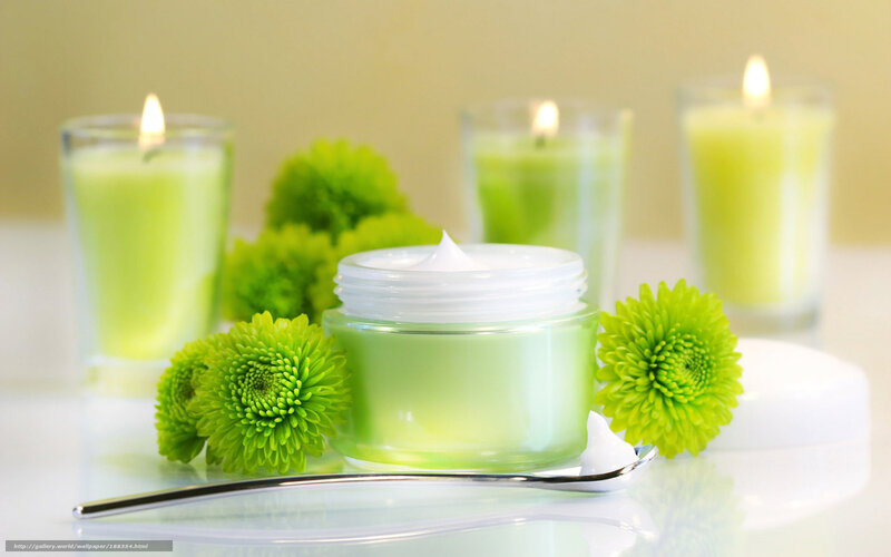 Green cream with candles and flowers