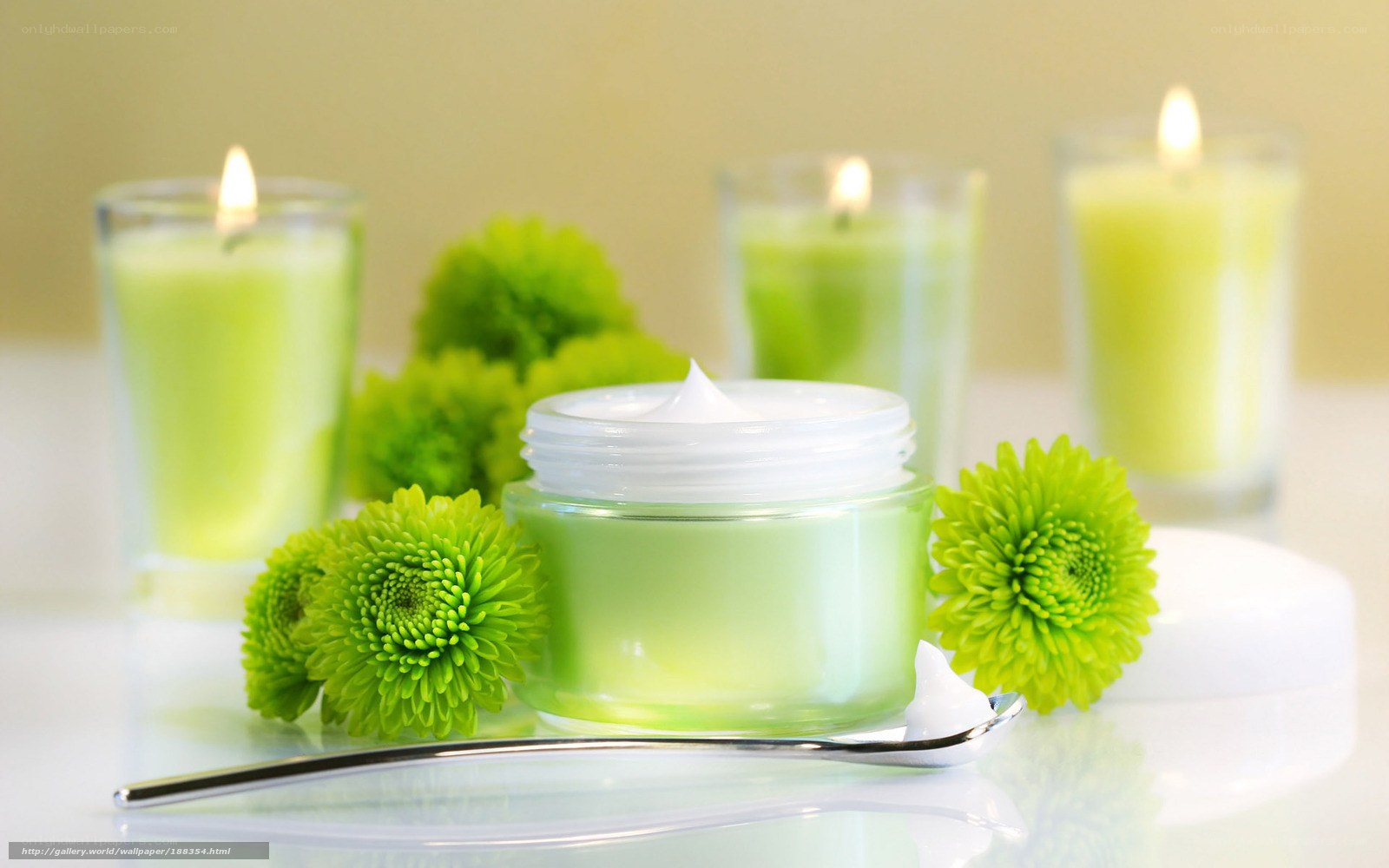 Green cream with candles and flowers