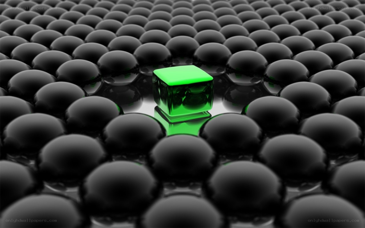 green cube among black spheres