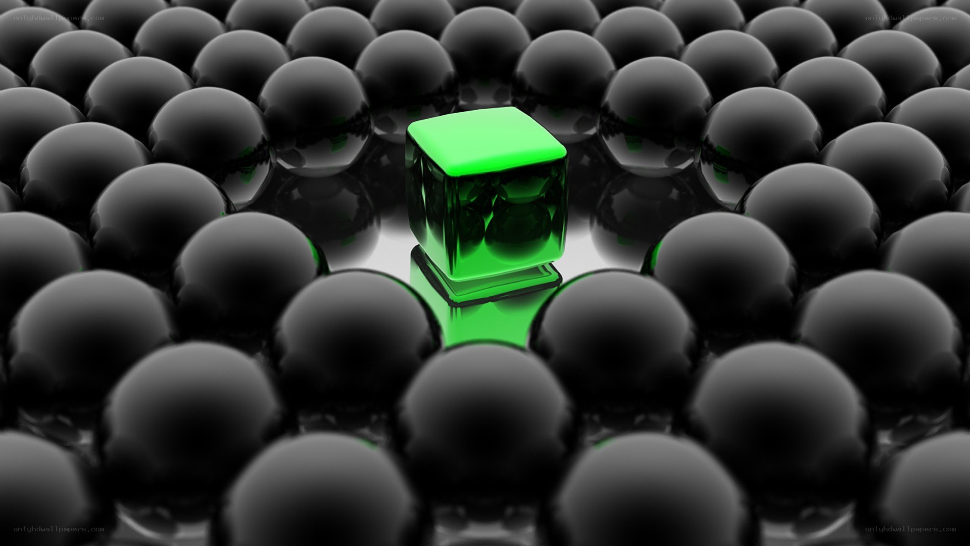 green cube among black spheres