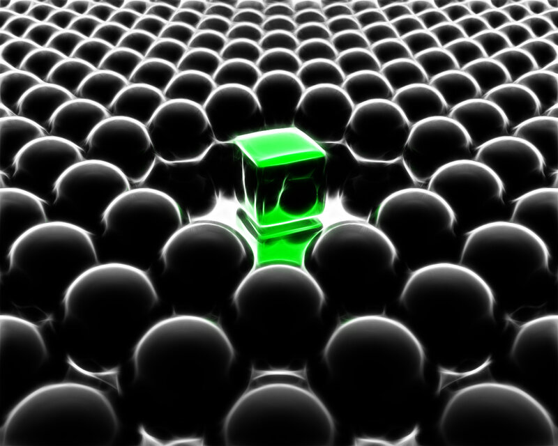 Green cube in a grid of spheres