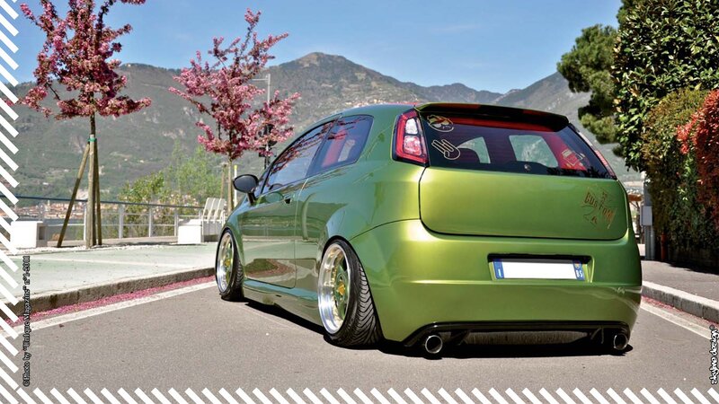 green custom car on a scenic road