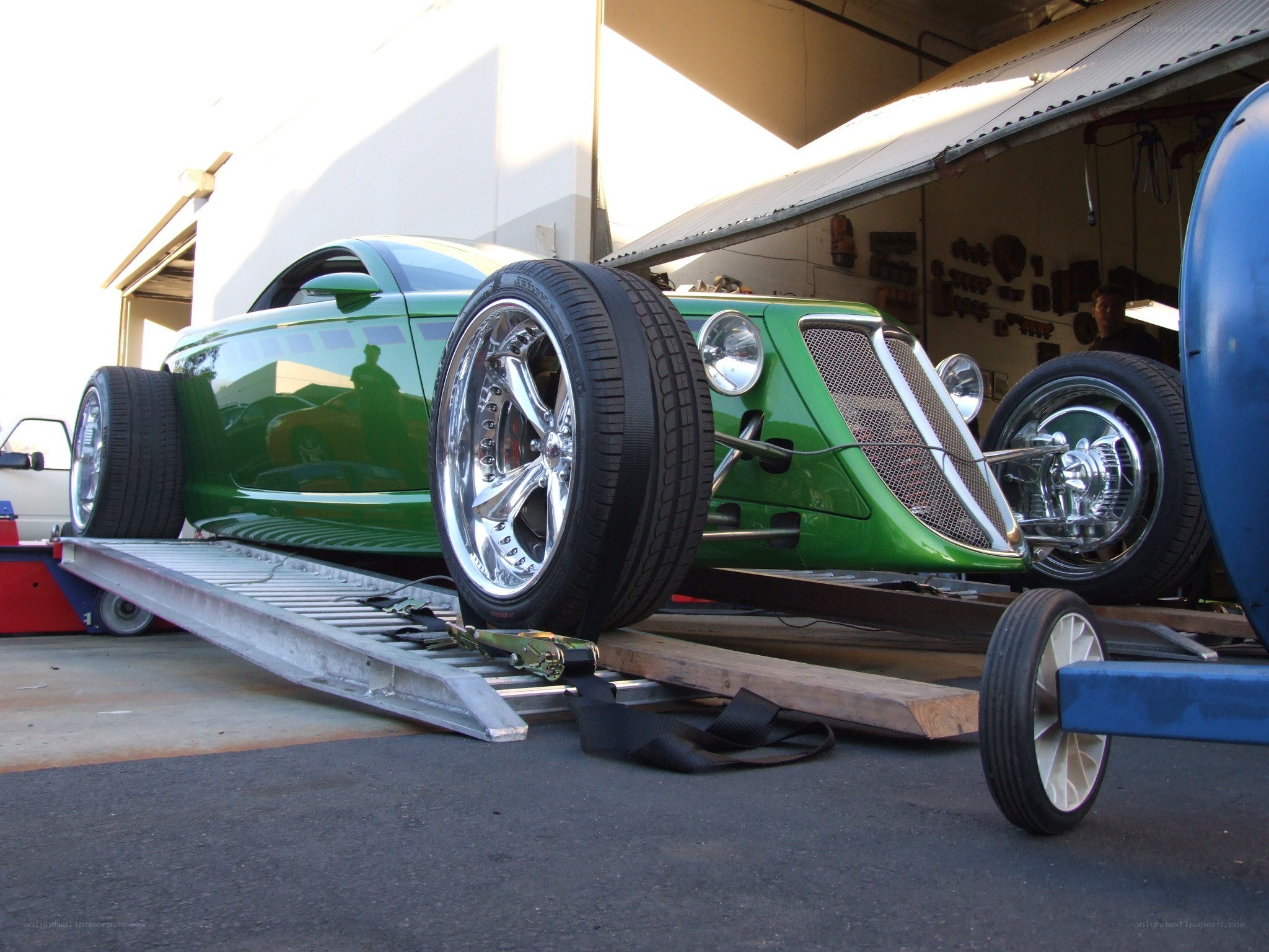 green custom car on trailer