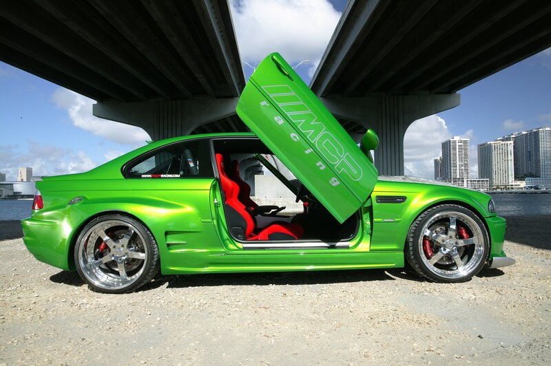 green custom car under bridge