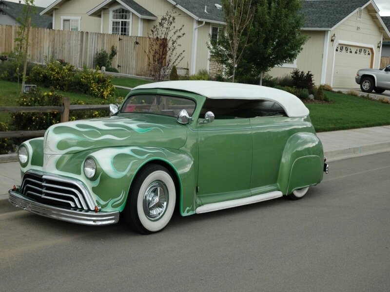 green custom car with flame design