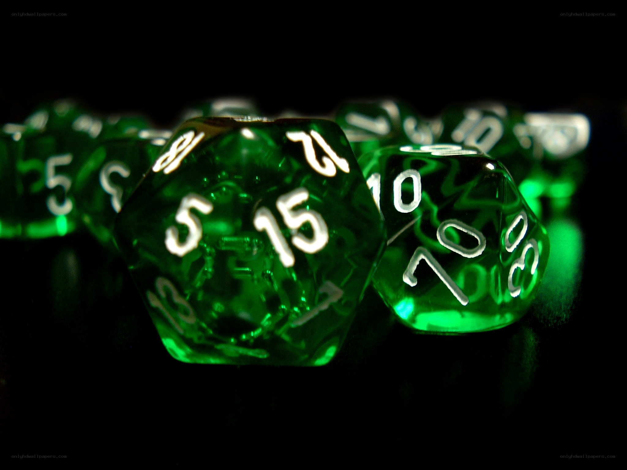 Green dice on black background
