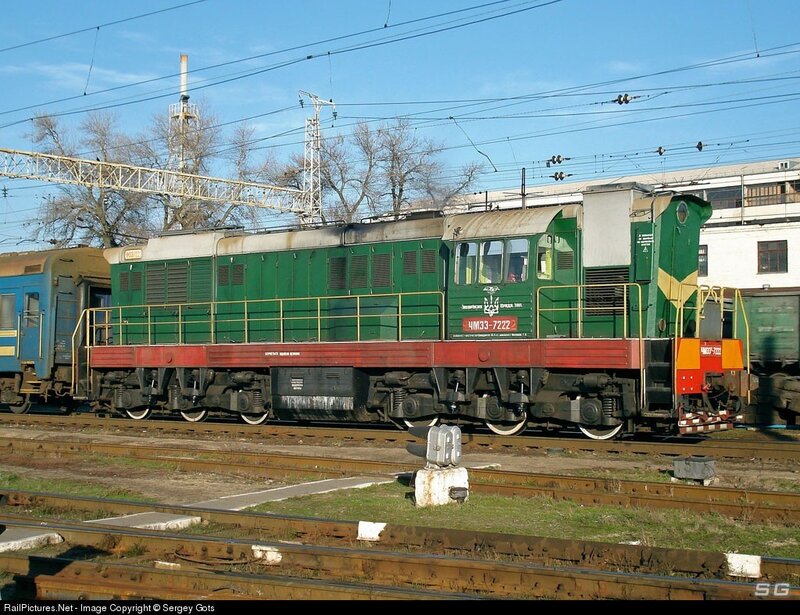 Green diesel locomotive on tracks