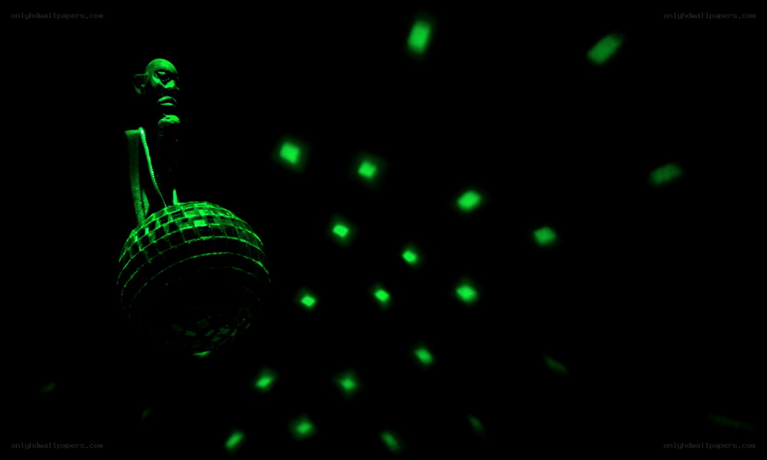 green disco ball in dark room