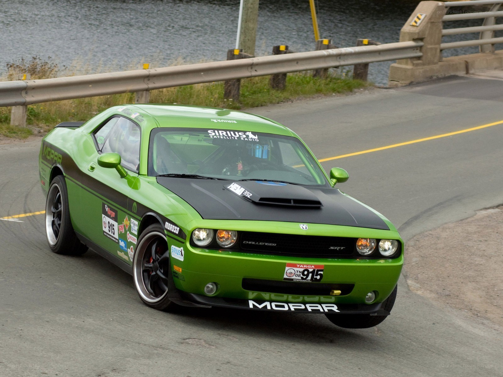 Green Dodge Challenger on a road
