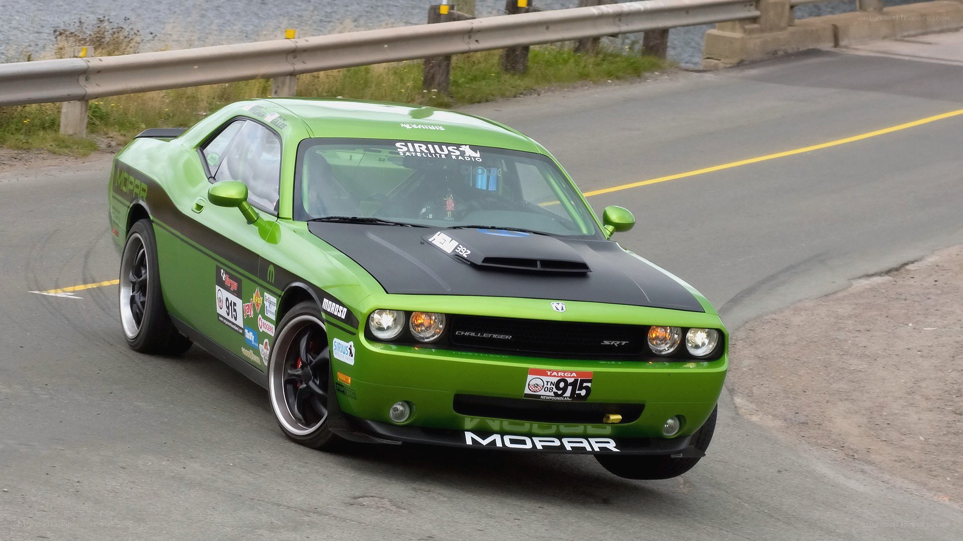 Green Dodge Challenger on track