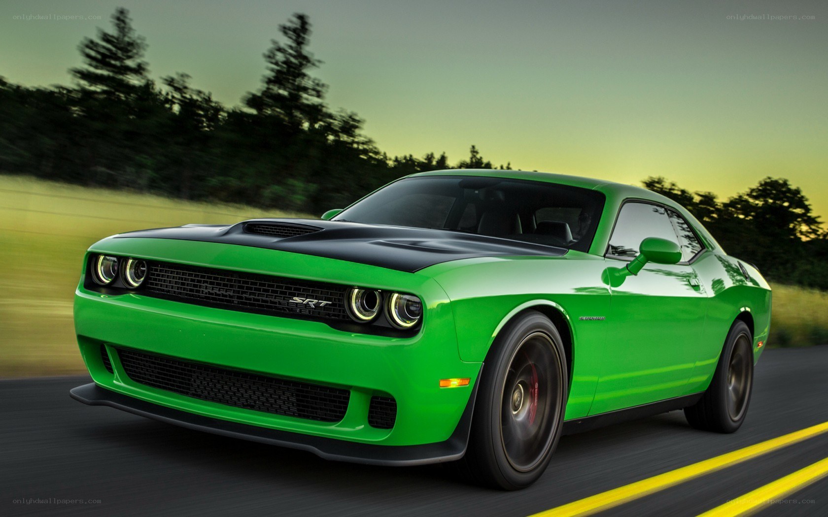 Green Dodge Challenger SRT in motion