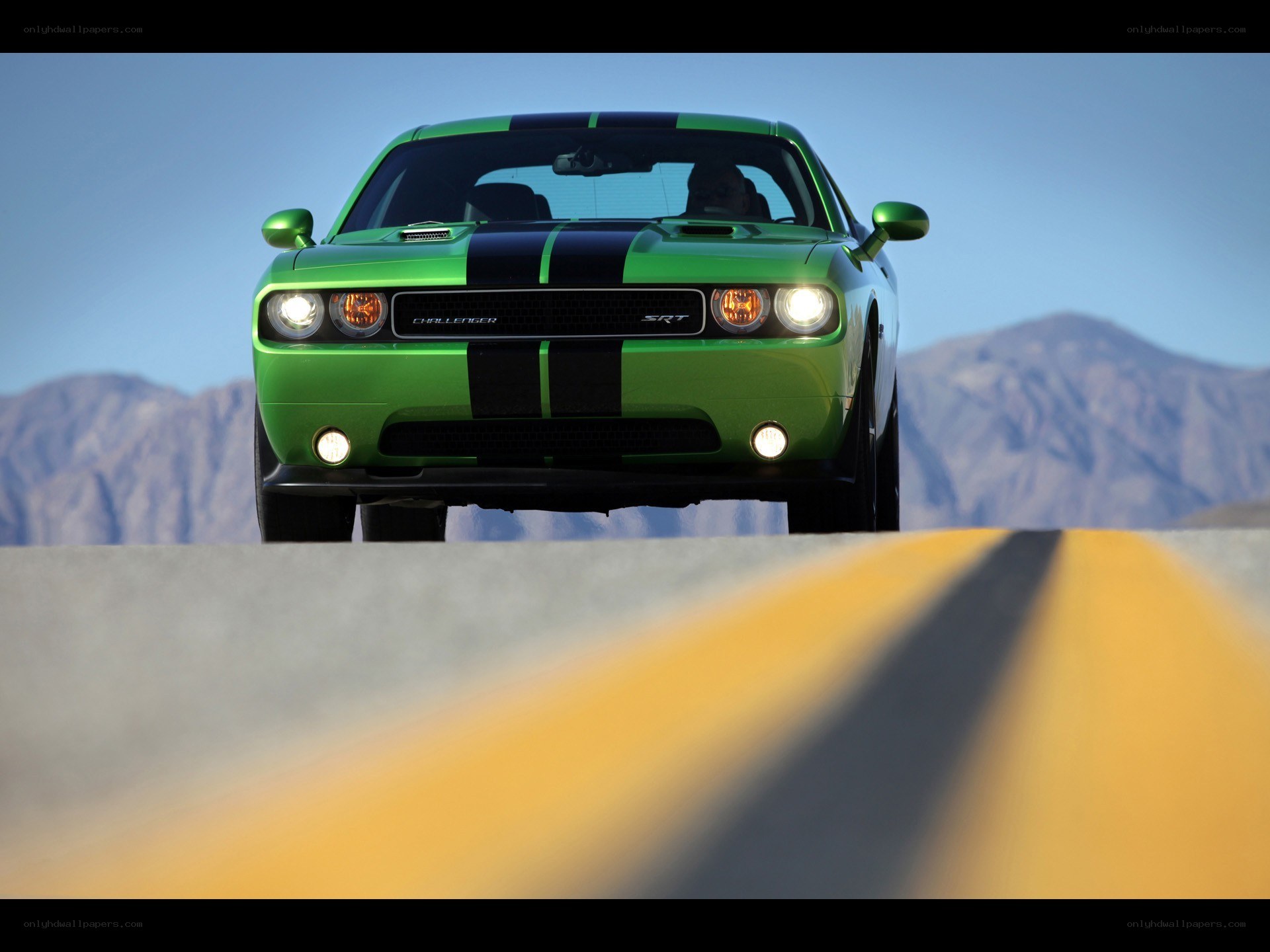 Green Dodge Challenger SRT on road