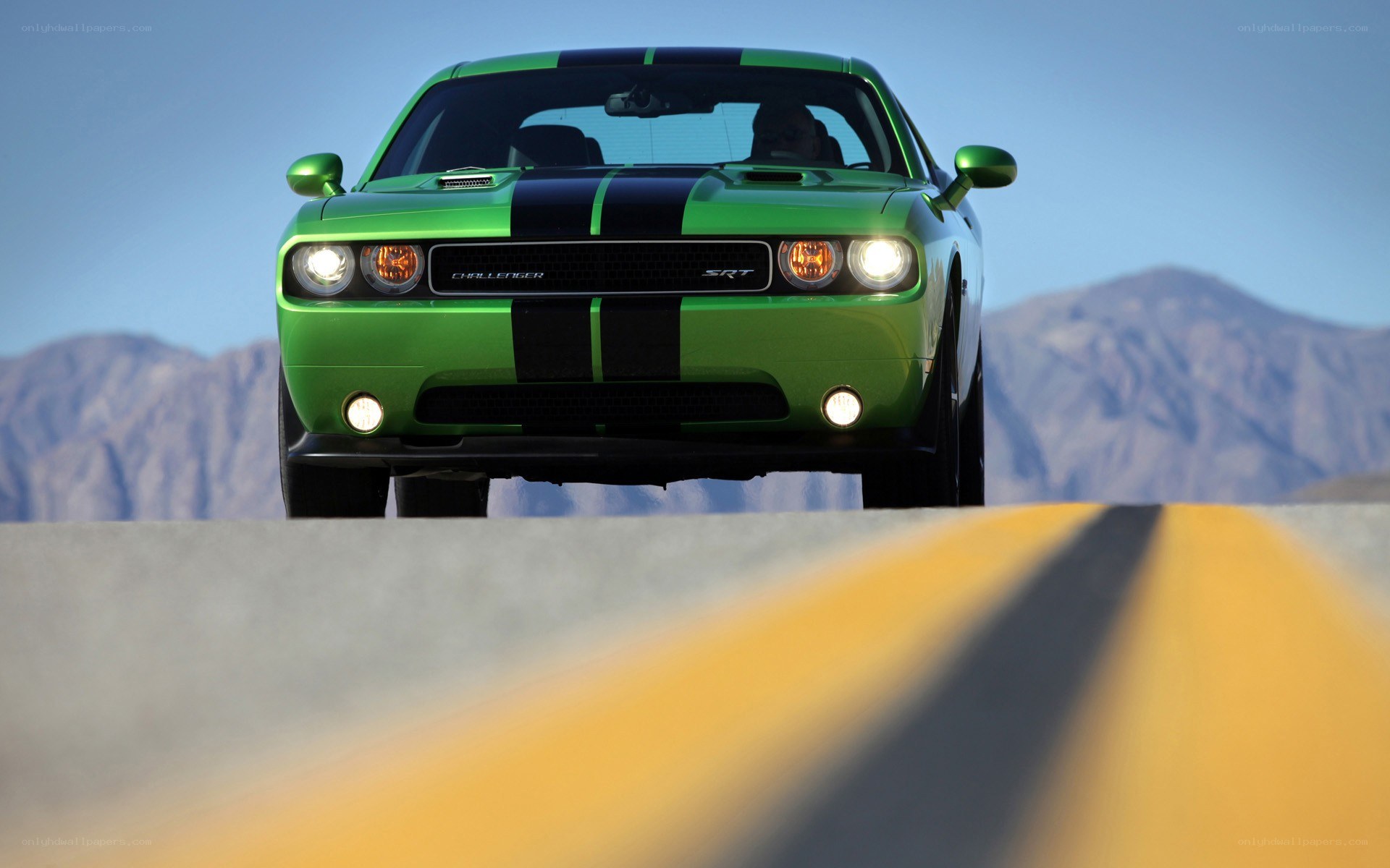 Green Dodge Challenger SRT on road