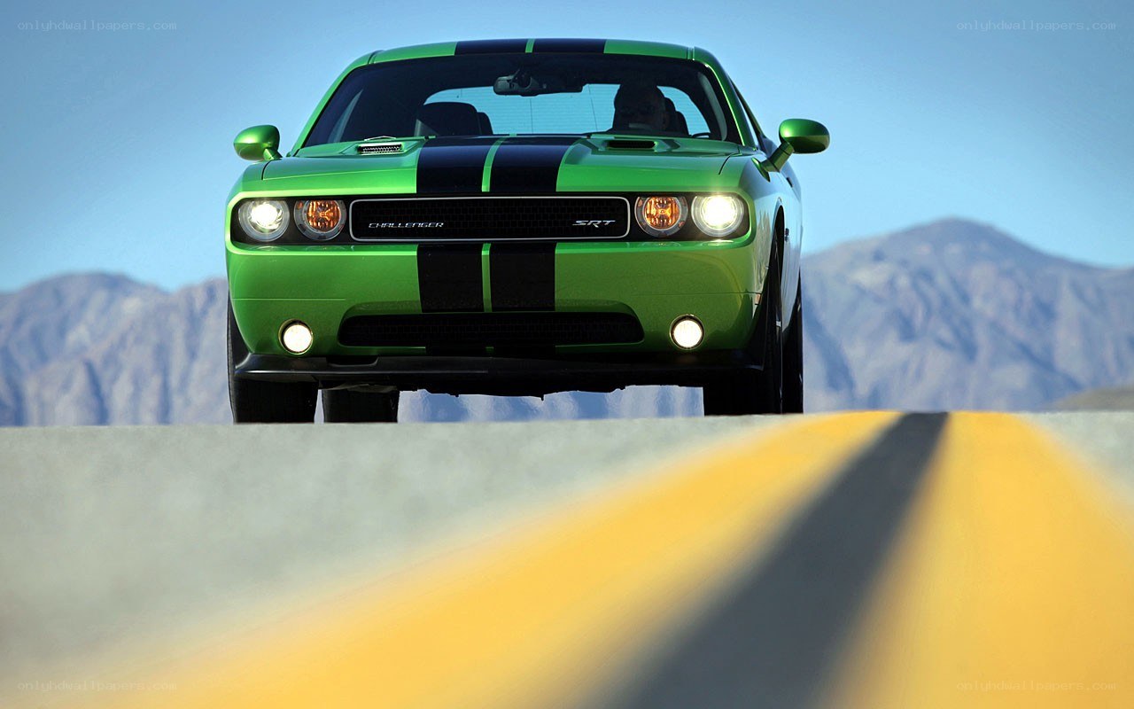Green Dodge Challenger SRT on road