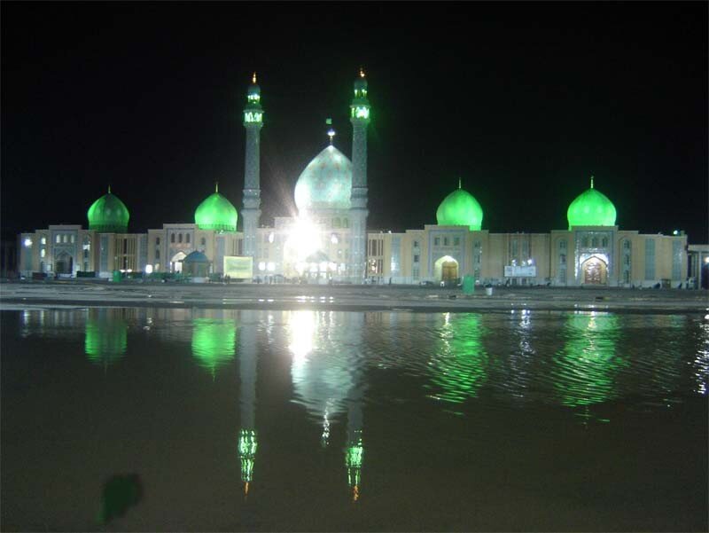 Green-domed mosque at night