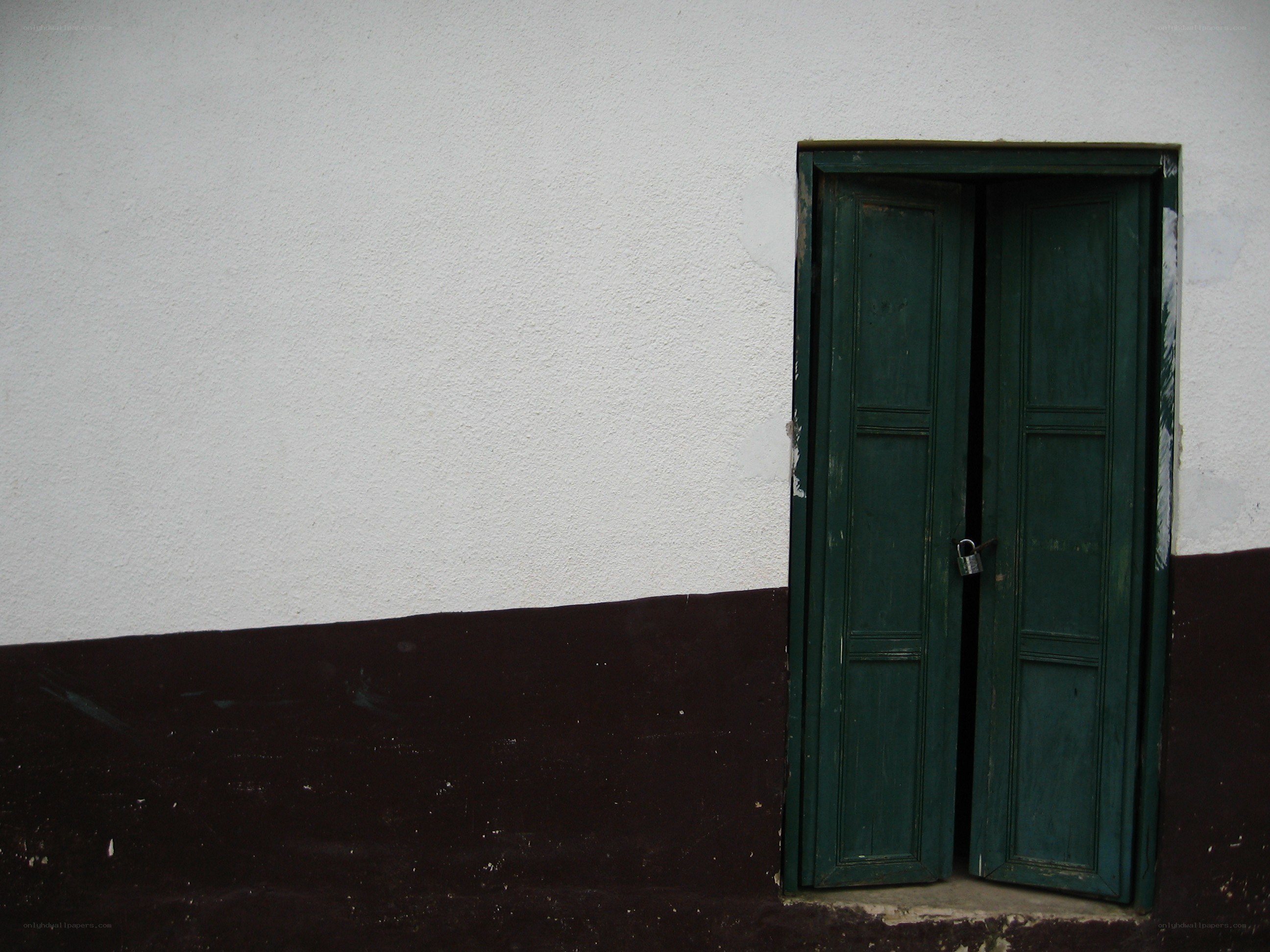 green door on white wall