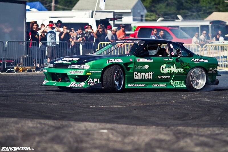 Green drift car at a race