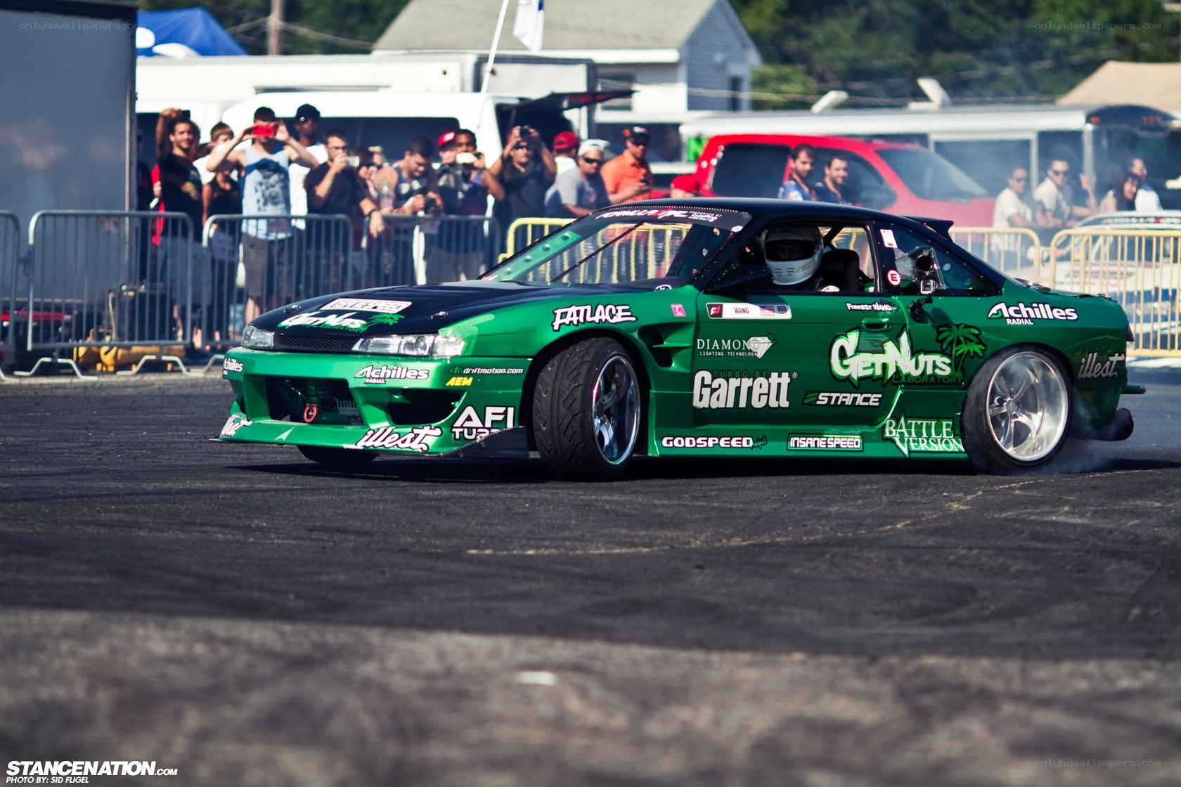 Green drift car at a race