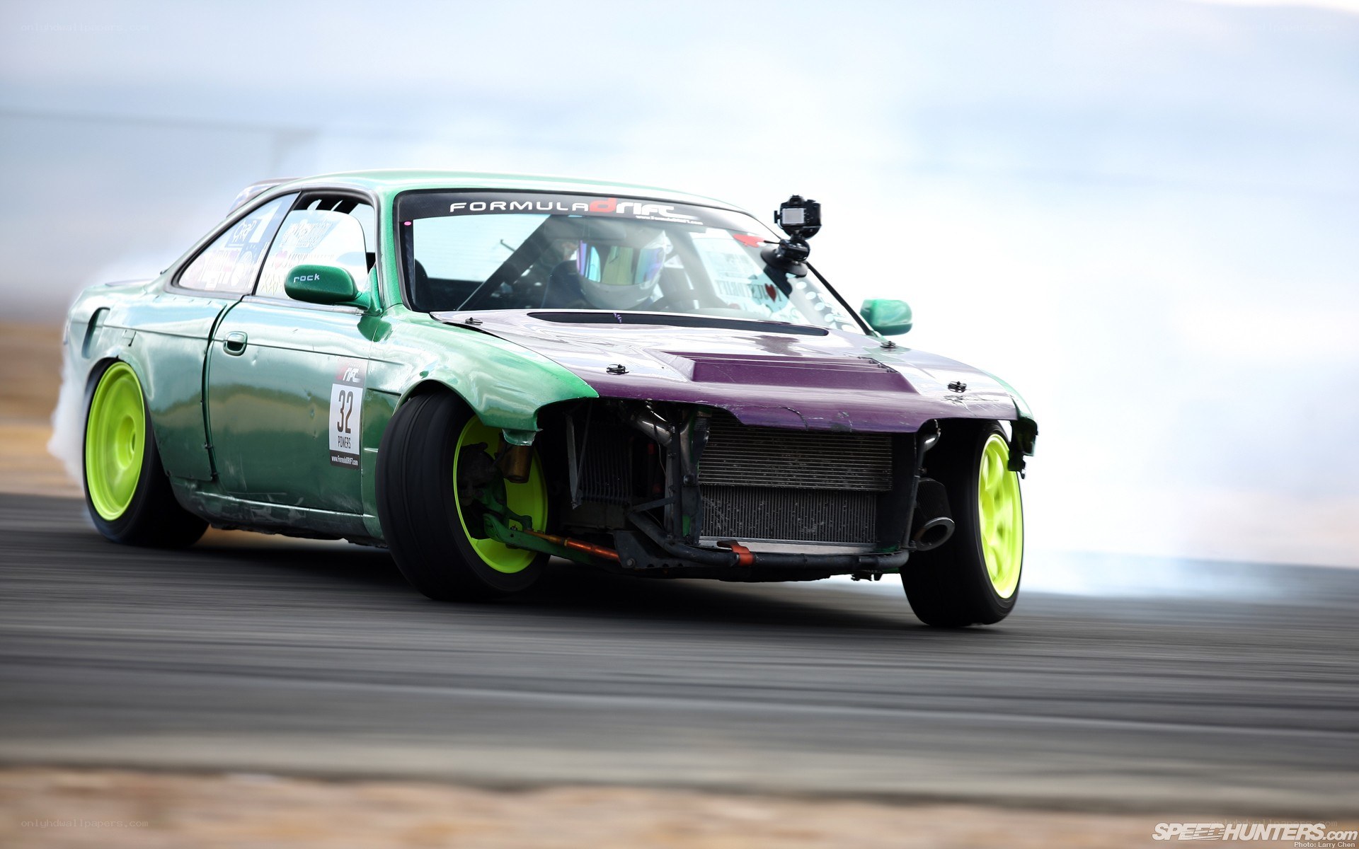 green drift car in action