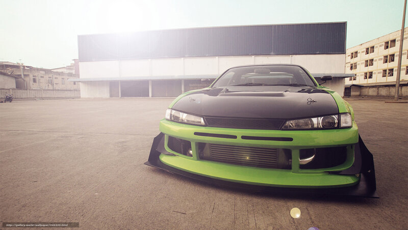 green drift car in parking lot
