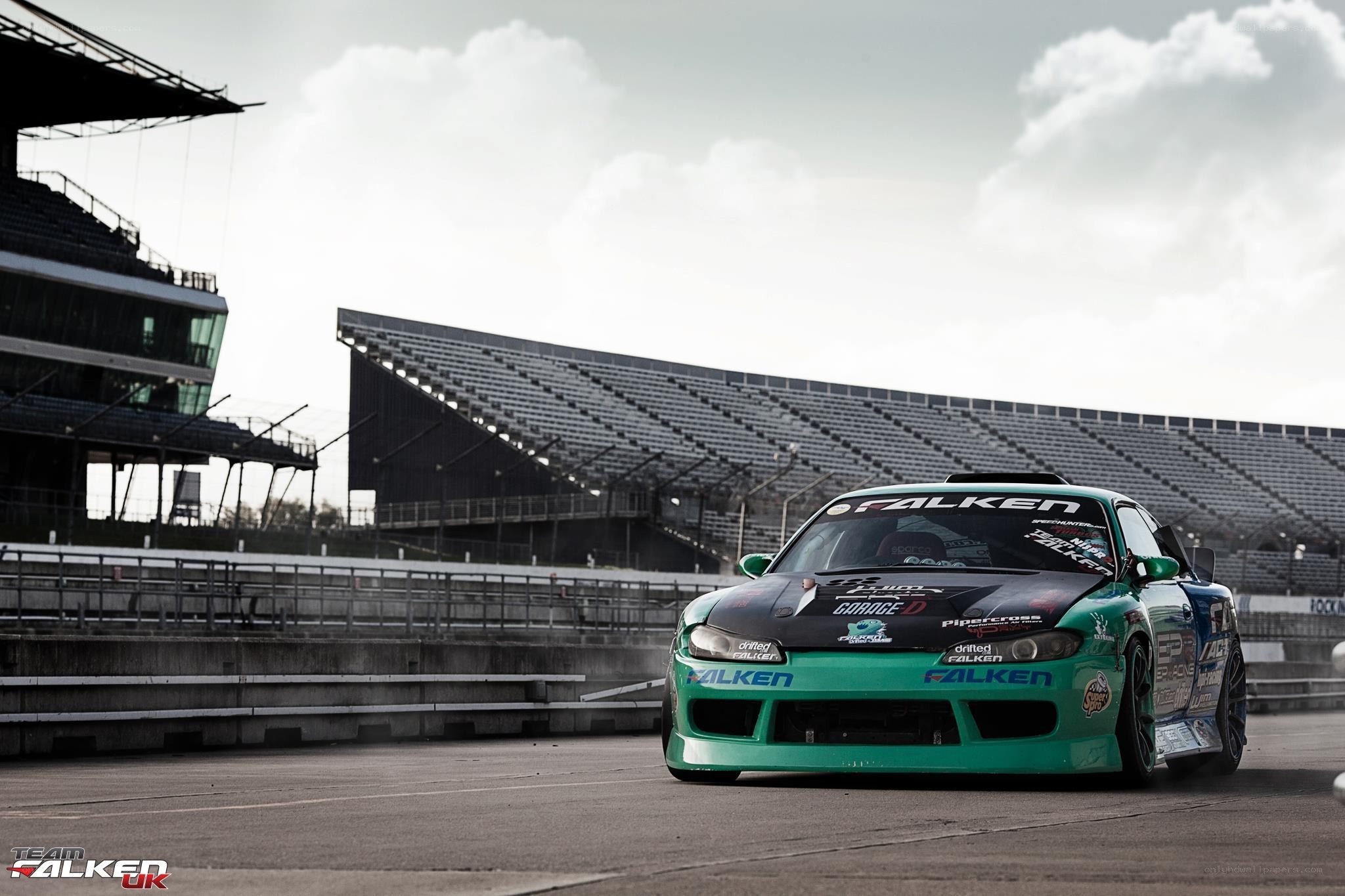 Green drift car on racetrack