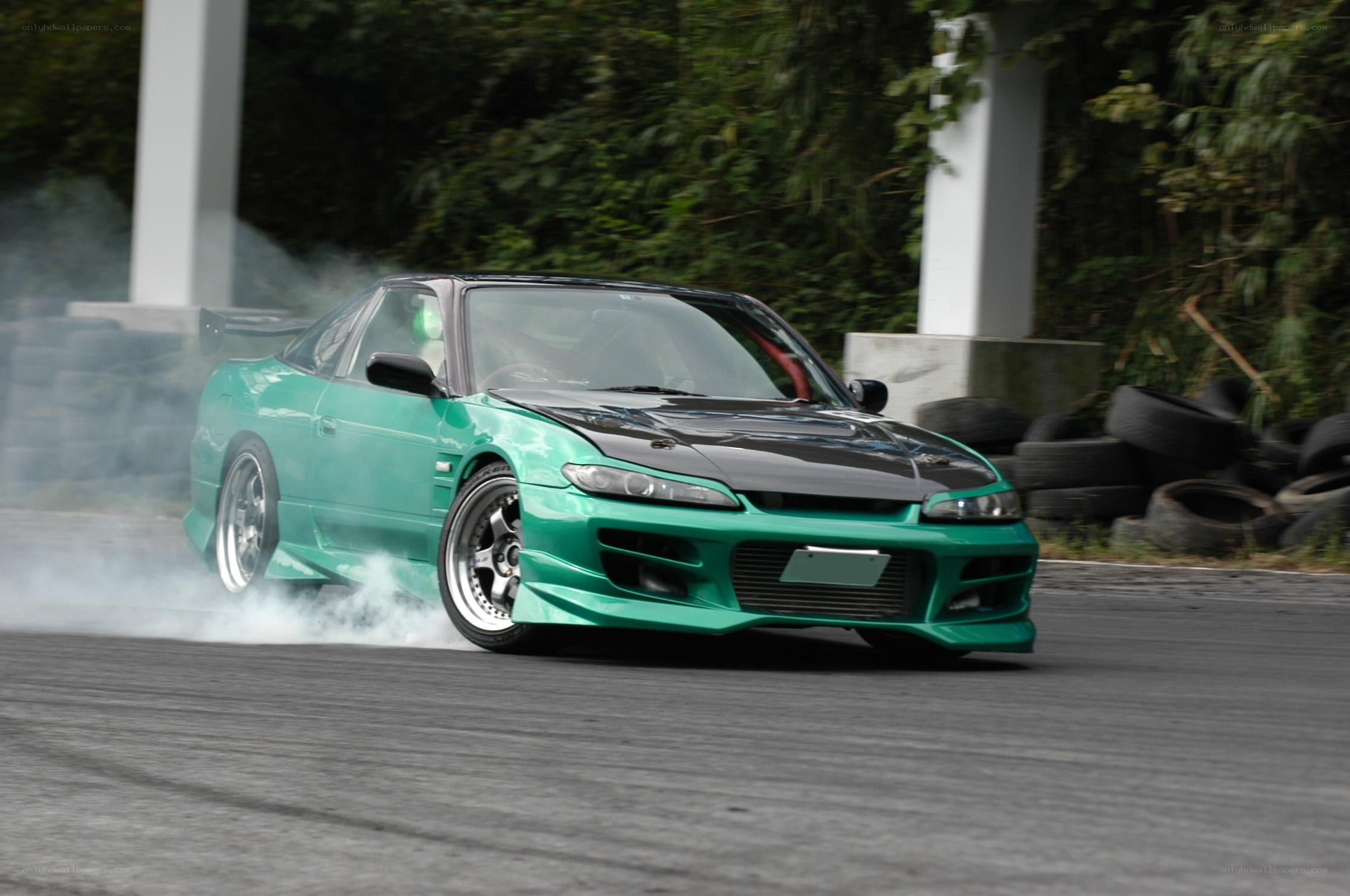 Green drift car on track