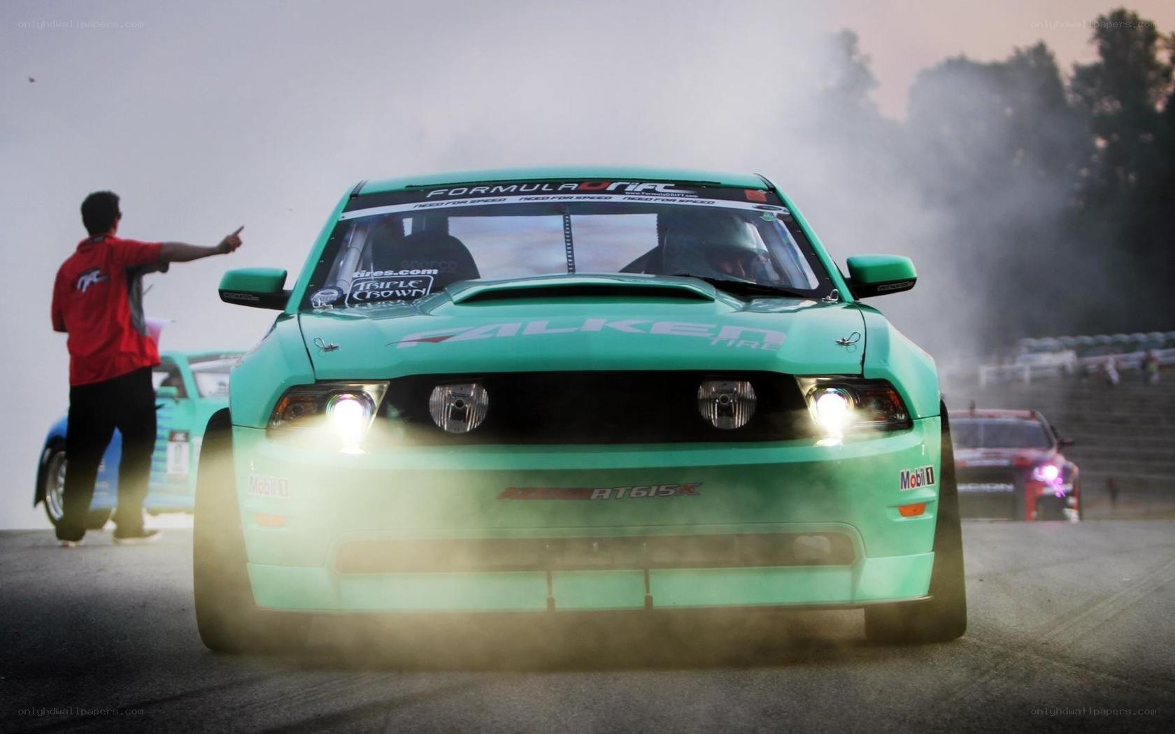 Green drift car on track