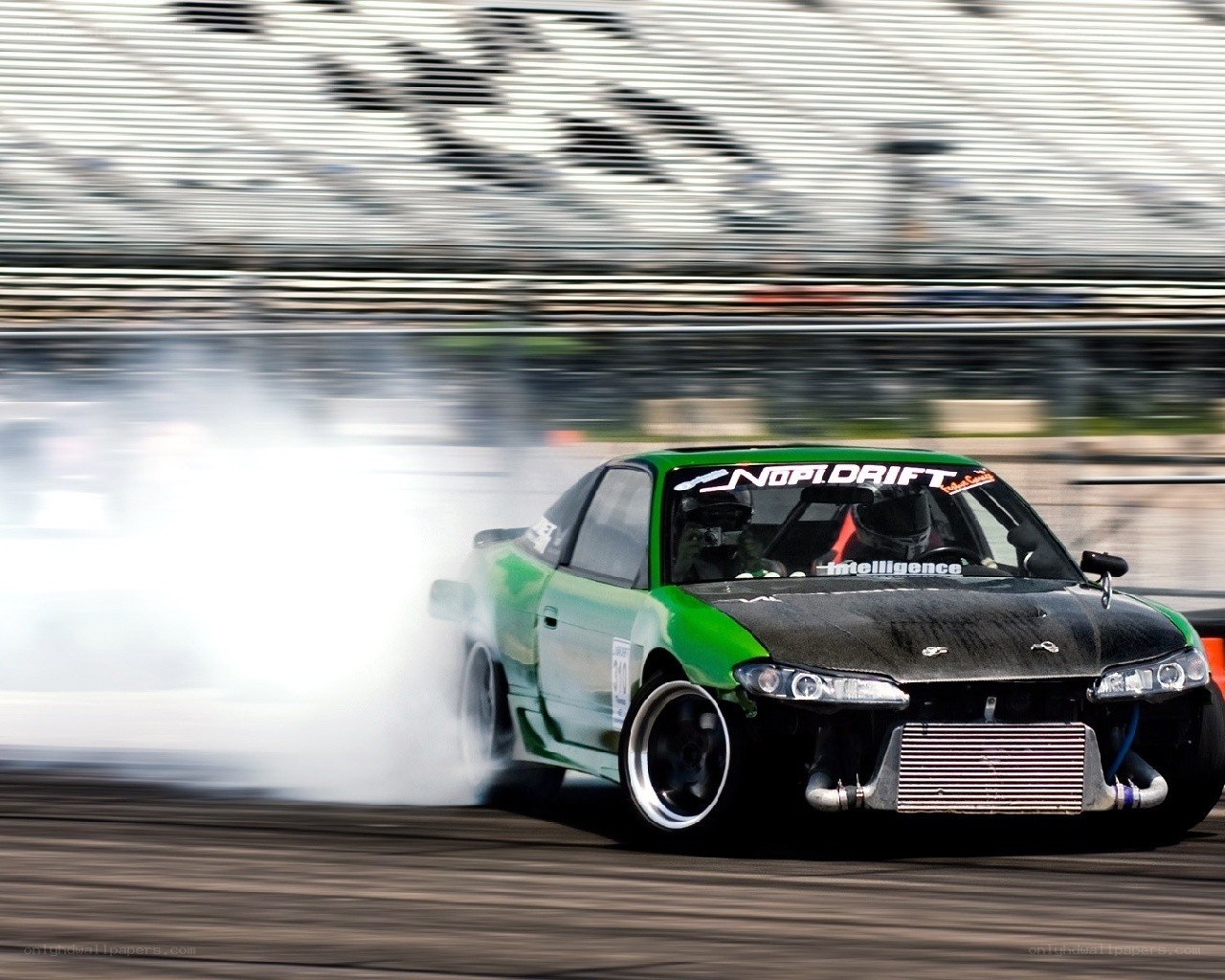Green drift car on track