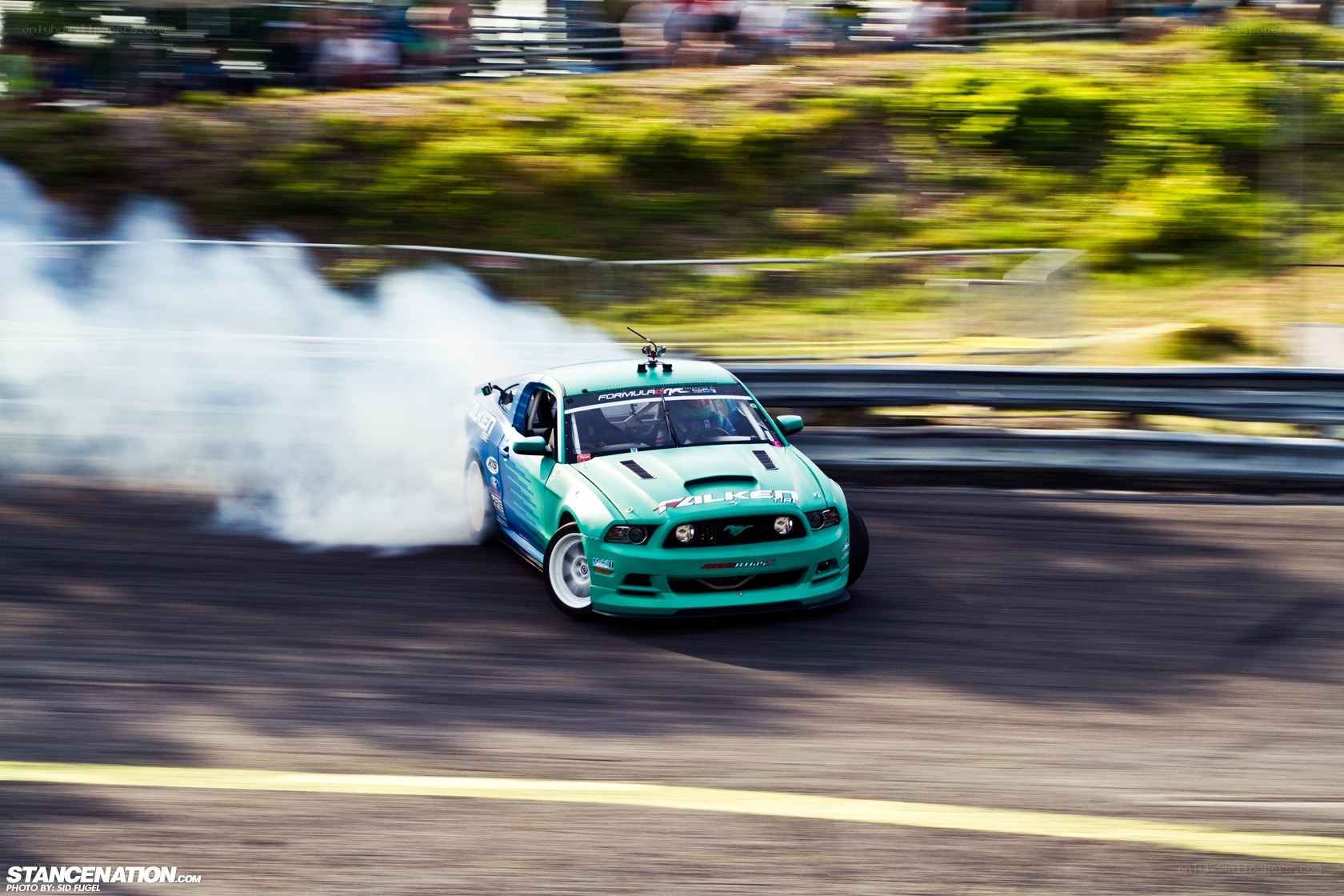 Green drift car on track