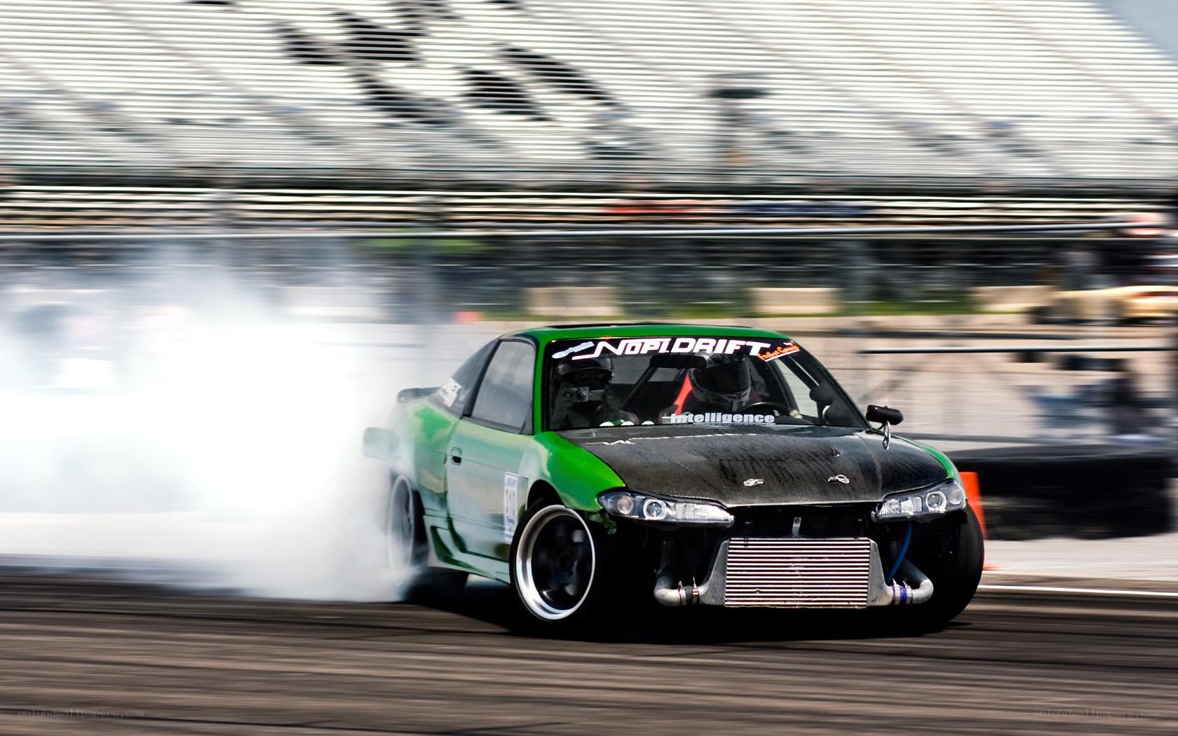 Green drift car on track