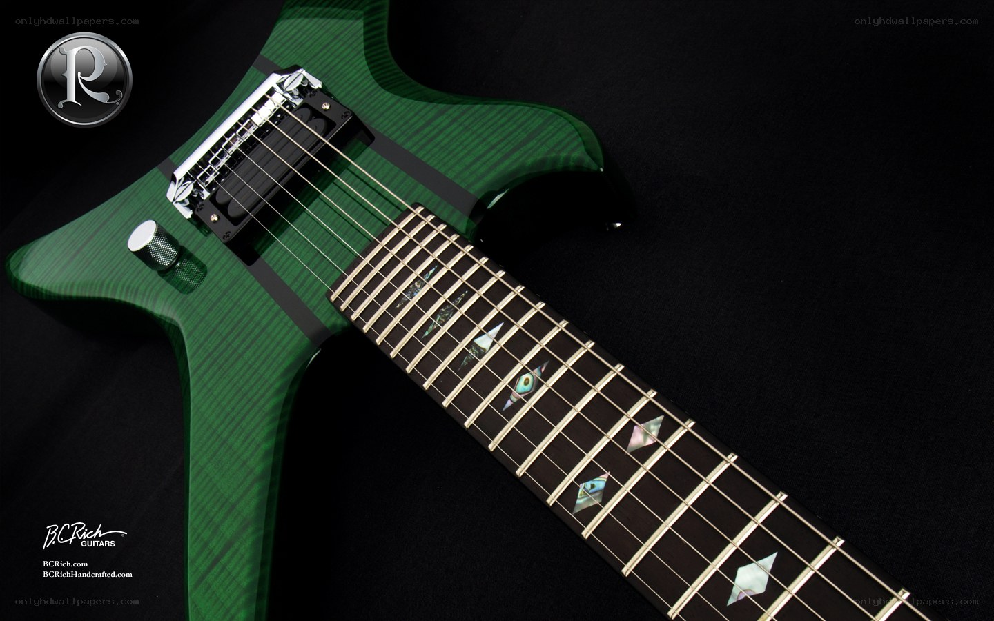 green electric guitar with inlays