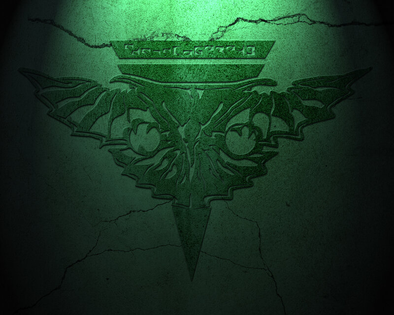 green emblem on cracked wall