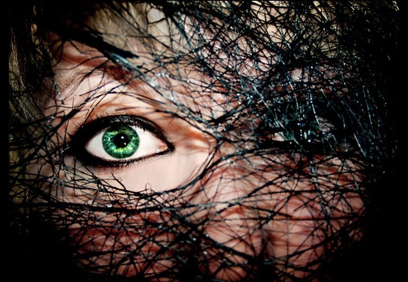 Green Eye Behind Net